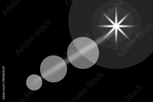 Abstract glowing star flare with circular light effects on black background