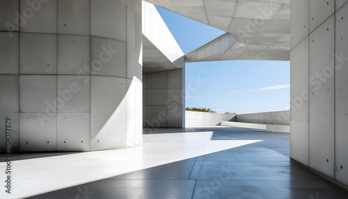 Modern, minimalist architecture featuring concrete walls and angular forms, dramatically lit by bright sunlight creating strong shadows. The images suggest a museum, gallery, or public space