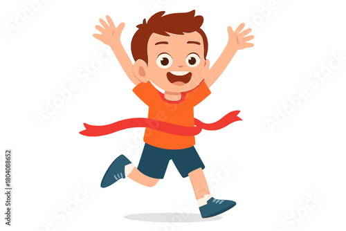 Young boy crossing the finish line ribbon with arms raised celebrating success and victory