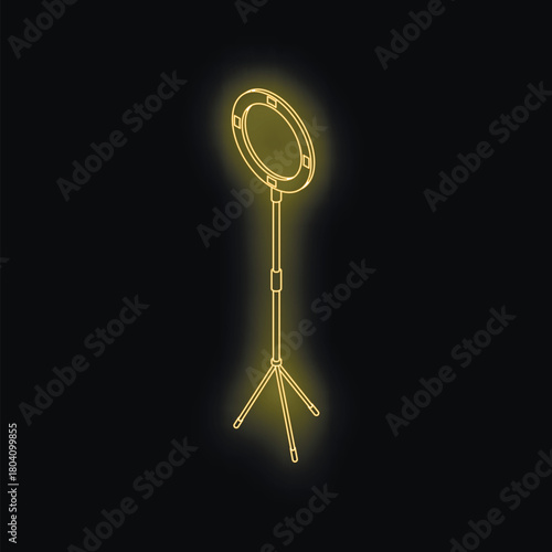 Golden ring light emitting bright light in dark studio, perfect for photography or videography