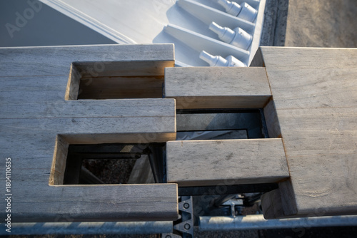 wooden expansion joint detail on a bridge handrail