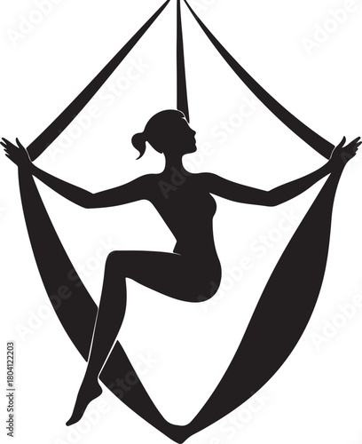Aerial yoga pose, black silhouette of a woman suspended in a silk hammock