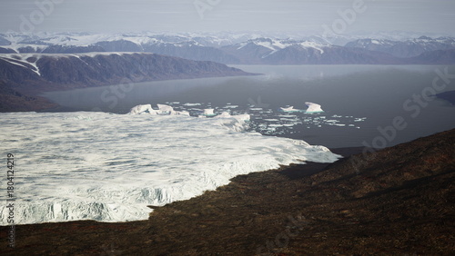 Wallpaper Mural Majestic glaciers flow down rocky slopes, merging with calm waters. Mountains tower in the background under a clear sky, highlighting natures beauty and fragility at this remote Arctic location. Torontodigital.ca