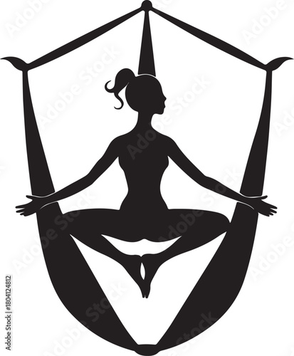 Aerial yoga pose, black silhouette of a woman suspended in a silk hammock