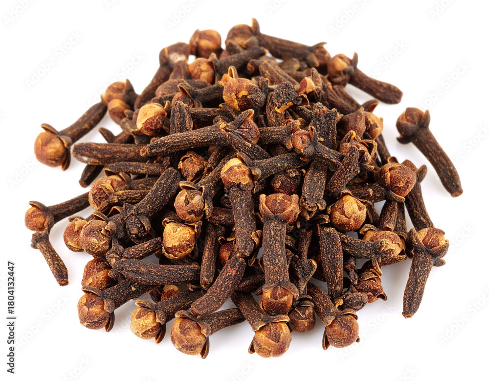 Fototapeta premium Pile of cloves aromatic spice on white surface