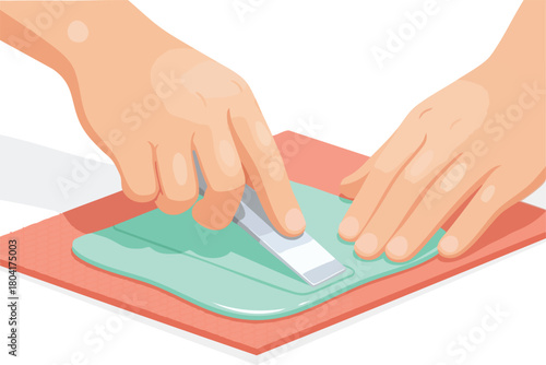 Hands smoothing a soft teal material on a surface using a flat scraper tool