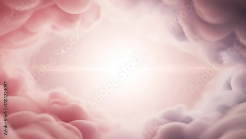 Ink in water creating a beautiful abstract cloudscape with a bright light in the center.