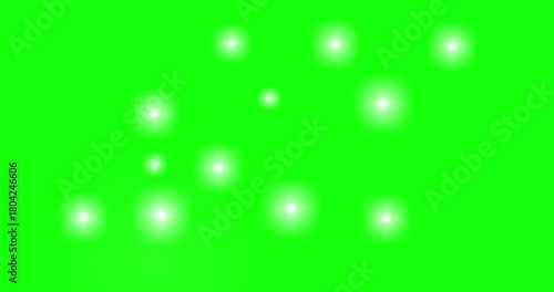 Random flashing lights on green background	