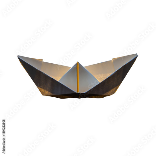 Paper boat origami craft illuminated from within white and grey with yellow accent on black background studio shot