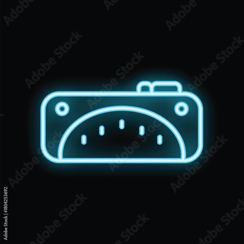 Neon blue icon of a speedometer is glowing on a black background