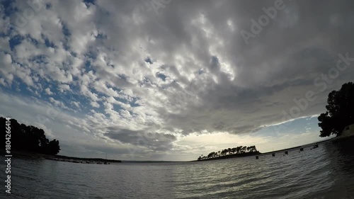 timelapse of clouds, late afternoon, late autumn small bay, island of Rab, Croatia, Mediterranean