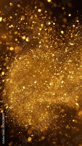 Abstract gold glitter particles animation on dark background