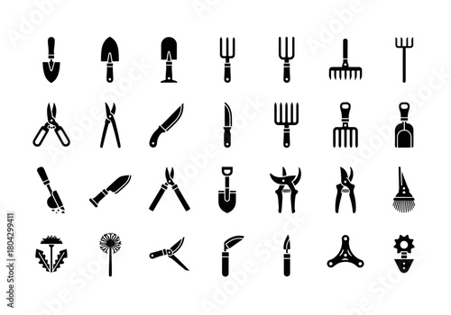 A detailed set of vector glyph icons representing various gardening and agricultural tools, featuring shovels, shears, and rakes in a solid black silhouette style