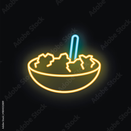 Neon sign showing salad bowl with fork on black background