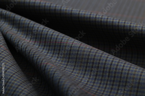 Wallpaper Mural Close-up of a rich, dark wool suiting fabric featuring a subtle Glen Plaid Prince of Wales check, accented by a bold, thin red overcheck. Premium textile for elegant, heritage-inspired jackets. Torontodigital.ca
