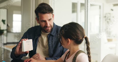 Photos Homework, alphabet card and dad with girl in home for lesson, learning and help with activity