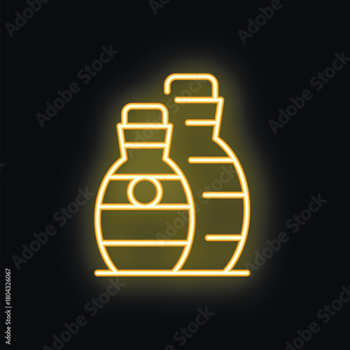 Yellow neon sign illustrating two amphora vases glowing on black background