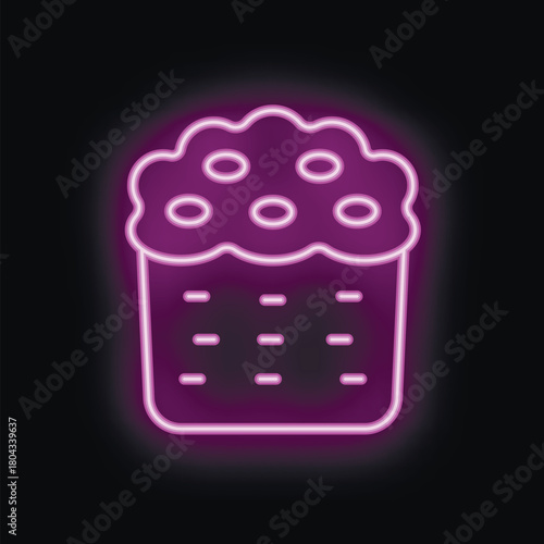 Purple neon sign depicting traditional easter cake with icing and sprinkles, emitting bright light on black background