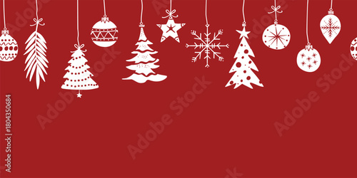 Christmas border seamless pattern with cute festive decorations on a plain red background with copy-space for text.