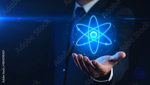 Futuristic Blue Atomic Symbol Hovering Above Businessman’s Hand