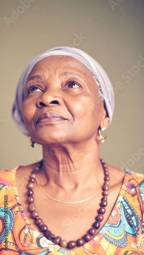 Elderly Woman in Soft Light Wearing Colorful Patterned Clothing