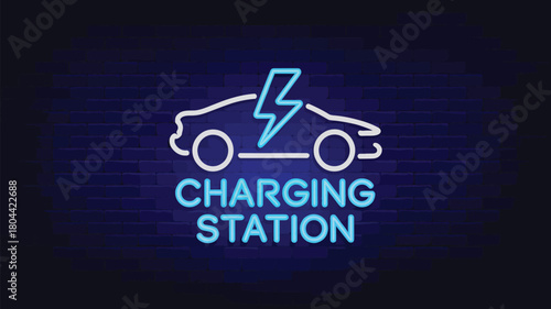 Green Electric Car Charging at Station with Plug Connected to Charging Point
