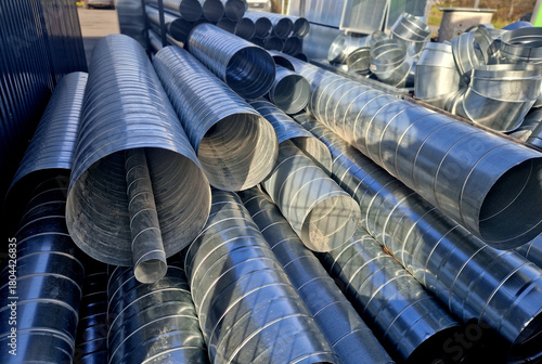 stainless steel, clay flexible chimney insert. Single shell gas liner. It ensures a clear passage of smoke and flue gases. a pile of bran nested on top of each other in a circular pattern shiny sheet 