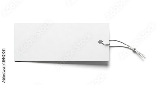 A simple white rectangular tag with a string attached on a plain white background in studio lighting