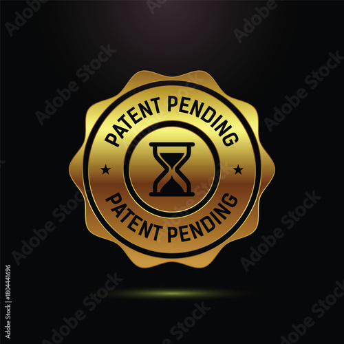 Golden Patent Pending Stamp with Hourglass Icon on Black Background