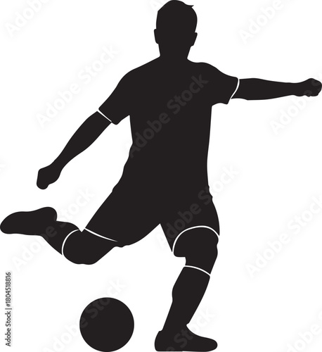Silhouette of a male soccer player in motion kicking a football during a game