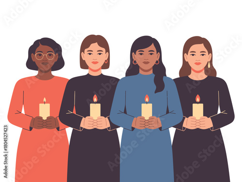Four women stand together holding lit candles in a solemn display.