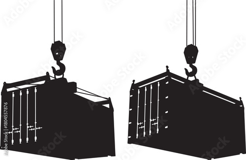 Two shipping containers being lifted by cranes silhouette