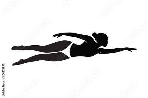 Silhouette of a woman swimming the freestyle stroke