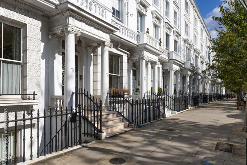 Classic Georgian style terrace homes in London with black wrought iron fences