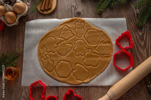 making homemade Christmas cookies on a wooden background. flat lay