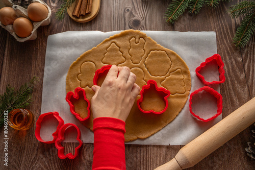 making homemade Christmas cookies on a wooden background. flat lay