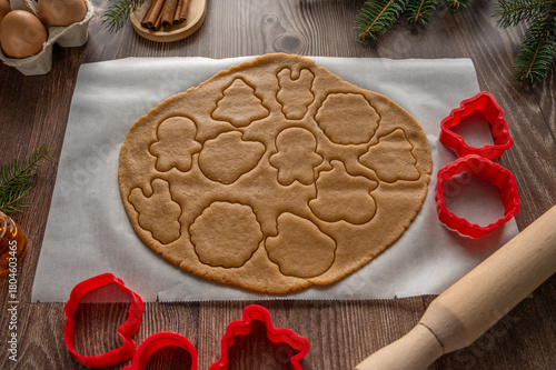 making homemade Christmas cookies on a wooden background. flat lay
