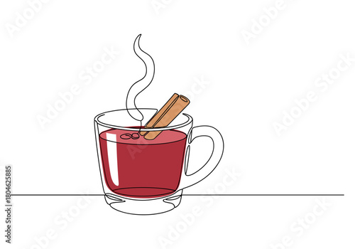 Hot mulled wine served in a glass cup with cinnamon stick and steam  