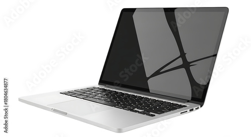 A sleek silver laptop with a dark screen and black keyboard on a black background in a studio shot