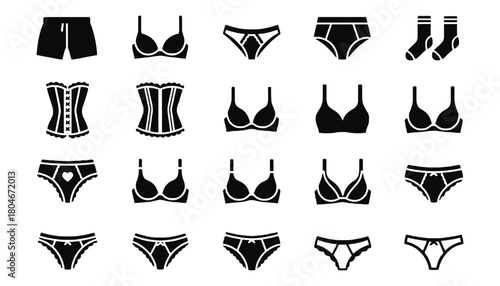 Assorted black and white lingerie items displayed on a white surface