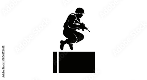 Silhouette of a soldier jumping over an obstacle while holding a rifle.