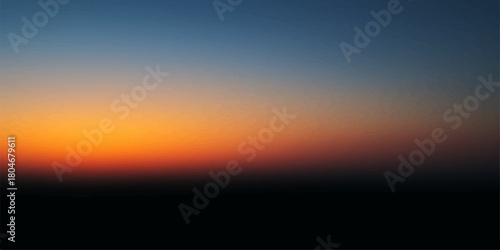Beautiful summer sunset over the sea with vibrant orange and red clouds painting the evening sky