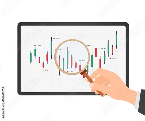 hand holding magnifying glass to graph on tablet.  rising stock market, investment success concept