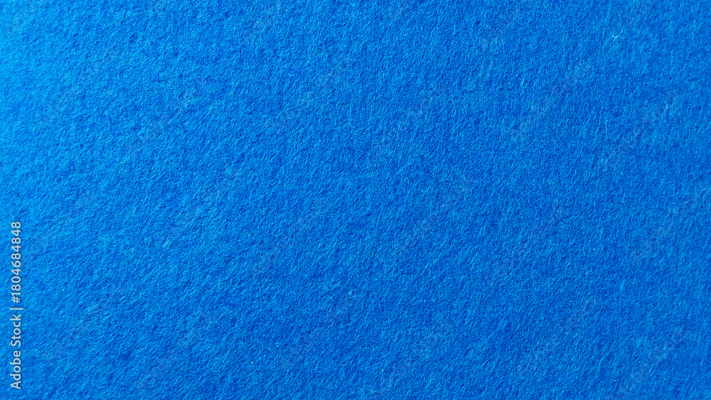 Naklejka premium Rich Royal Blue Felt Fabric Texture Macro Background with Fine Fiber Detail