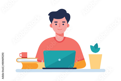 Young man working remotely on laptop at desk with books and plant, focused on his online tasks and studies, smiling