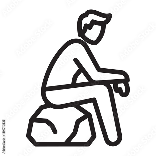 Man sitting on a rock in a thoughtful pose contemplation thinking