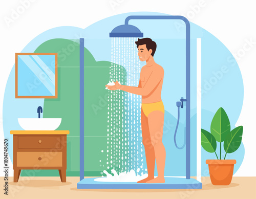 A man is showering in a glass-enclosed shower stall, holding soap, with a sink, mirror, and potted plant visible in the bathroom.