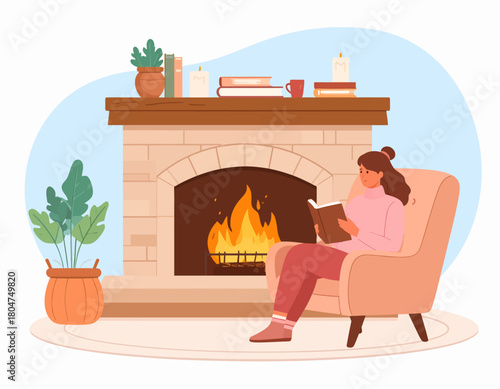 Woman reading a book in an armchair by a warm, inviting fireplace in a cozy room.