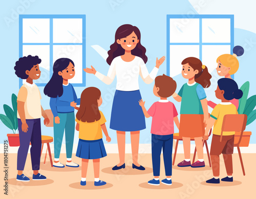 A female teacher stands in a classroom with her arms outstretched, surrounded by a group of diverse children listening attentively.