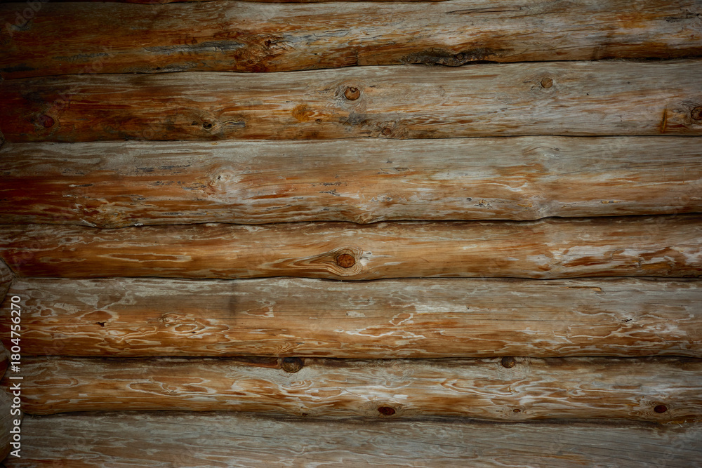 Fototapeta premium Rustic wooden logs create a warm and inviting atmosphere in a cabin interior setting